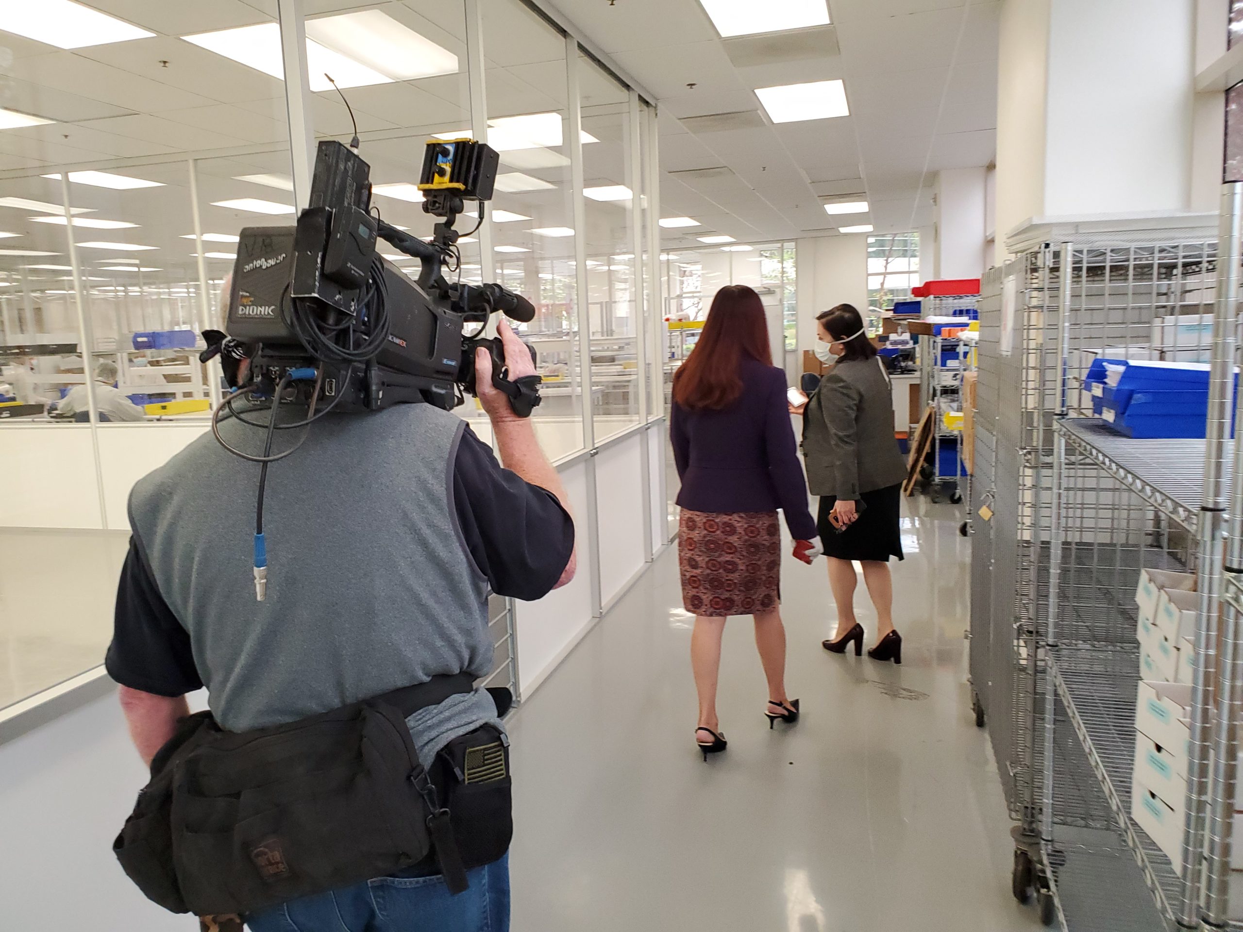 Fremont Mayor Mei touring Evolve Manufacturing Facility with CEO Noreen King. Broadcast camera follows. 